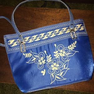 Royal blue hand bag with cream stitching